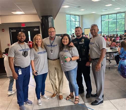 Liberty Middle administrators and School Resource Officer in school lunchroom